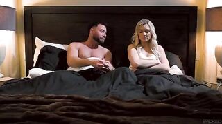 Two cute girls are having fun on the bed at night