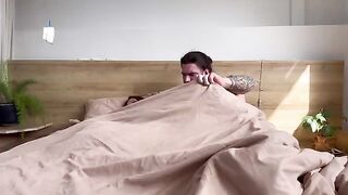 A stepmom is sharing a bed with her son in this steamy scene