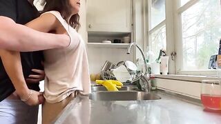 A hot brunette MILF with big natural tits gets fucked in the kitchen