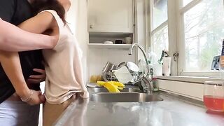 A hot brunette MILF with big natural tits gets fucked in the kitchen