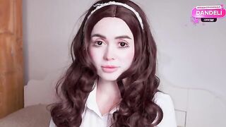 The girl is a sex doll in the arms of her master