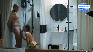 A couple enjoys an intimate moment in the shower, with the brunette getting on top