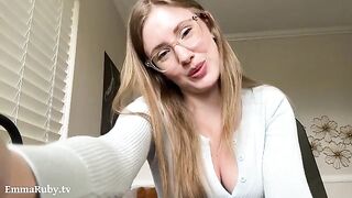 A girl with glasses drew on her lips with white makeup