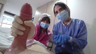 Two nurses examine the patient's cock in the hospital