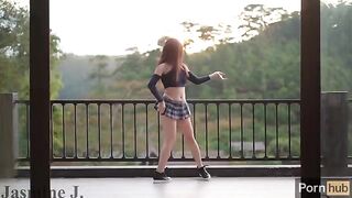 A cute Asian girl, Jasmine J, uses a sex machine to get a squirting orgasm on the balcony